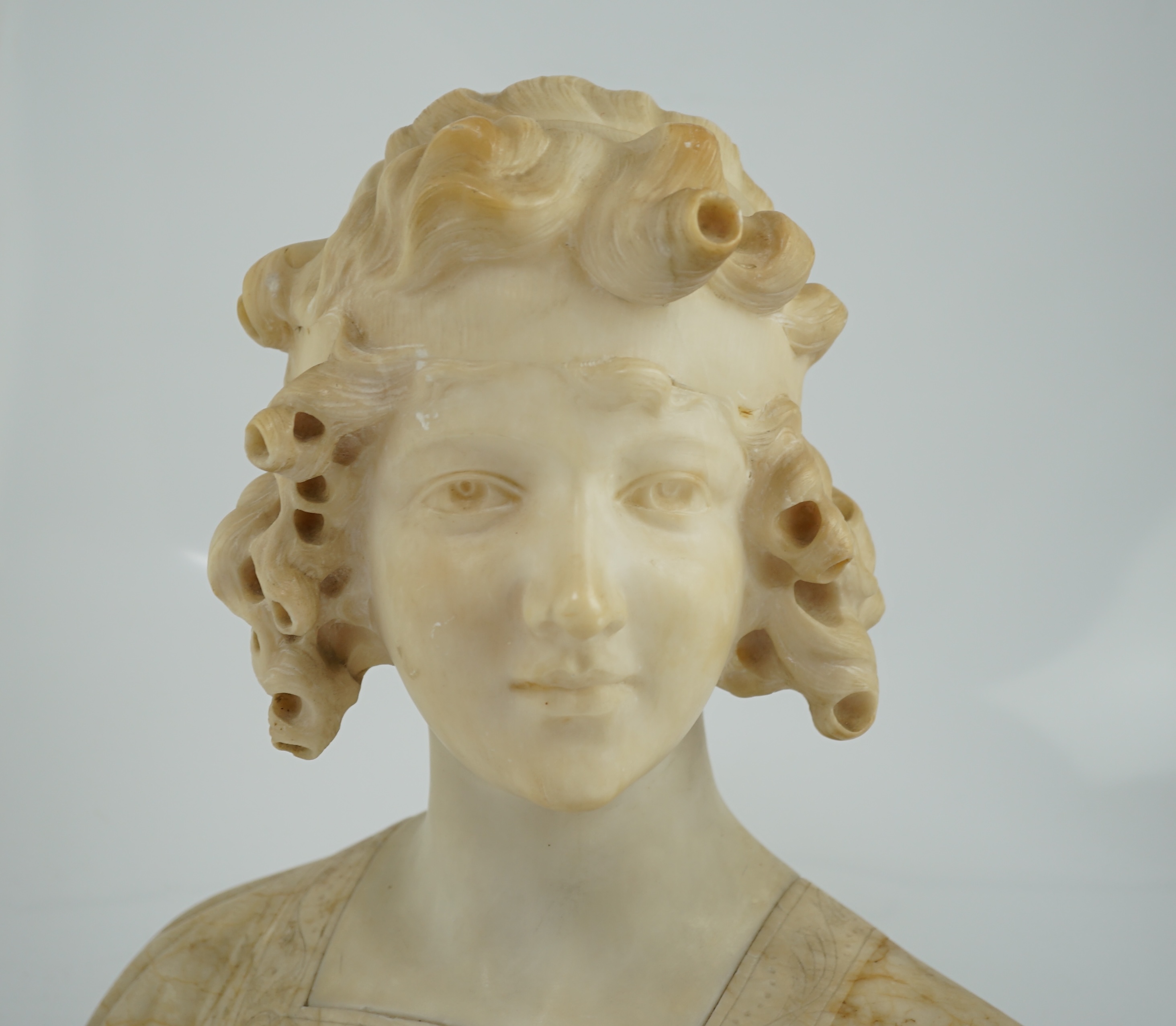 Magison Bland, an Art Nouveau alabaster head and shoulder study of a young beauty, 39cm wide, 36cm high